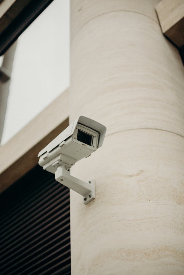 Wall-mounted CCTV camera on a building column
